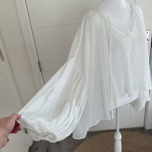 Elegant White Women's Oversized Peasant Crinkle hi-low Top with ballon sleeves .